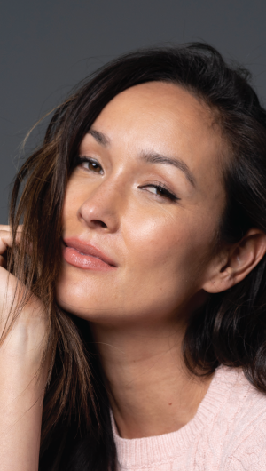 Woman with brunette hair and smooth skin